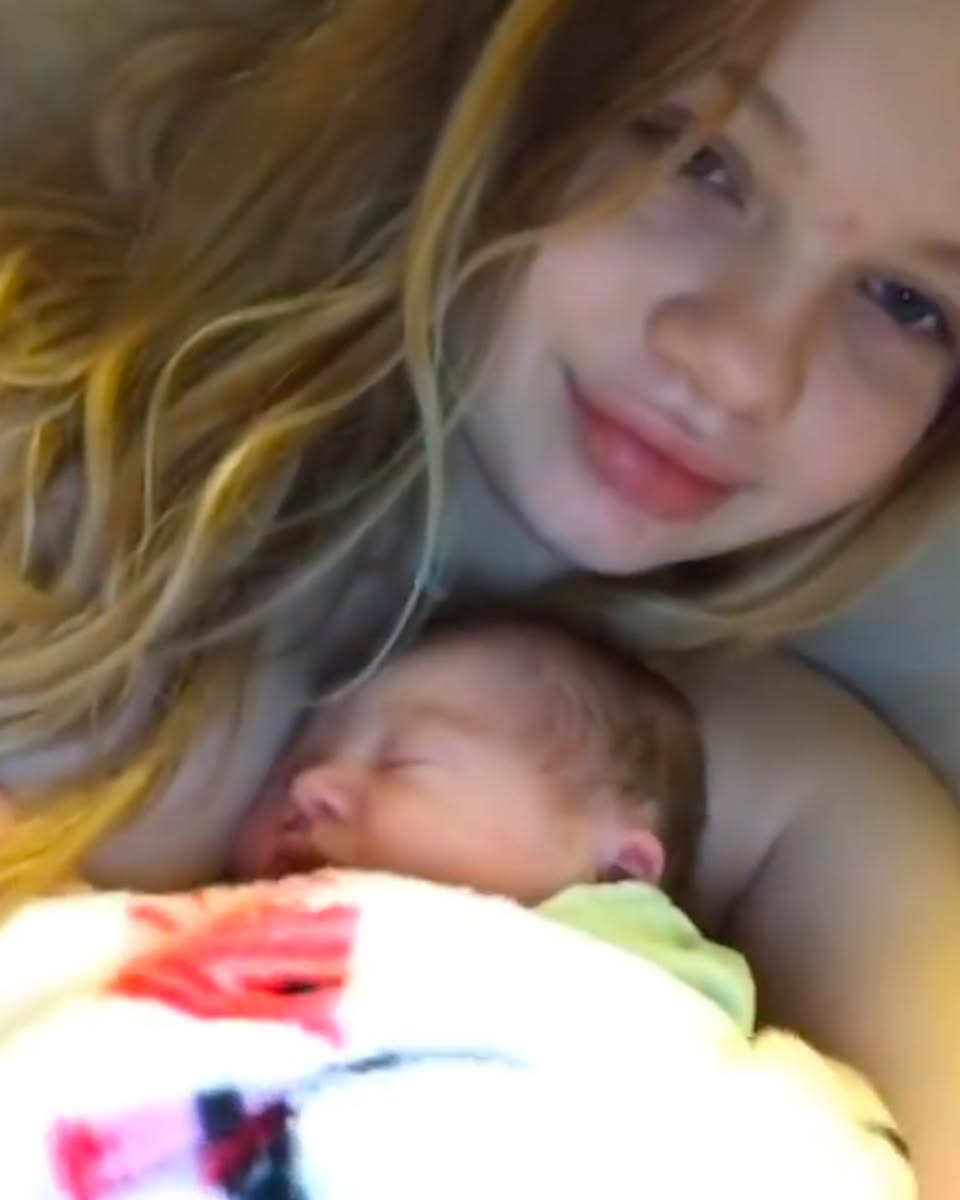 Maddie Lambert holding her baby